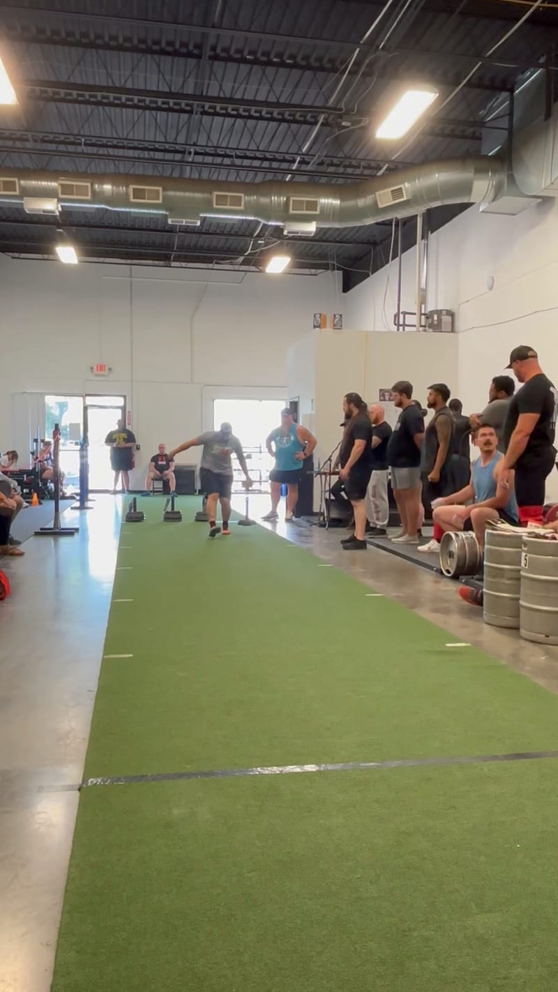 Spectators lining the competition floor at the Midsummer Melee, hosted at Per Aspera Strength